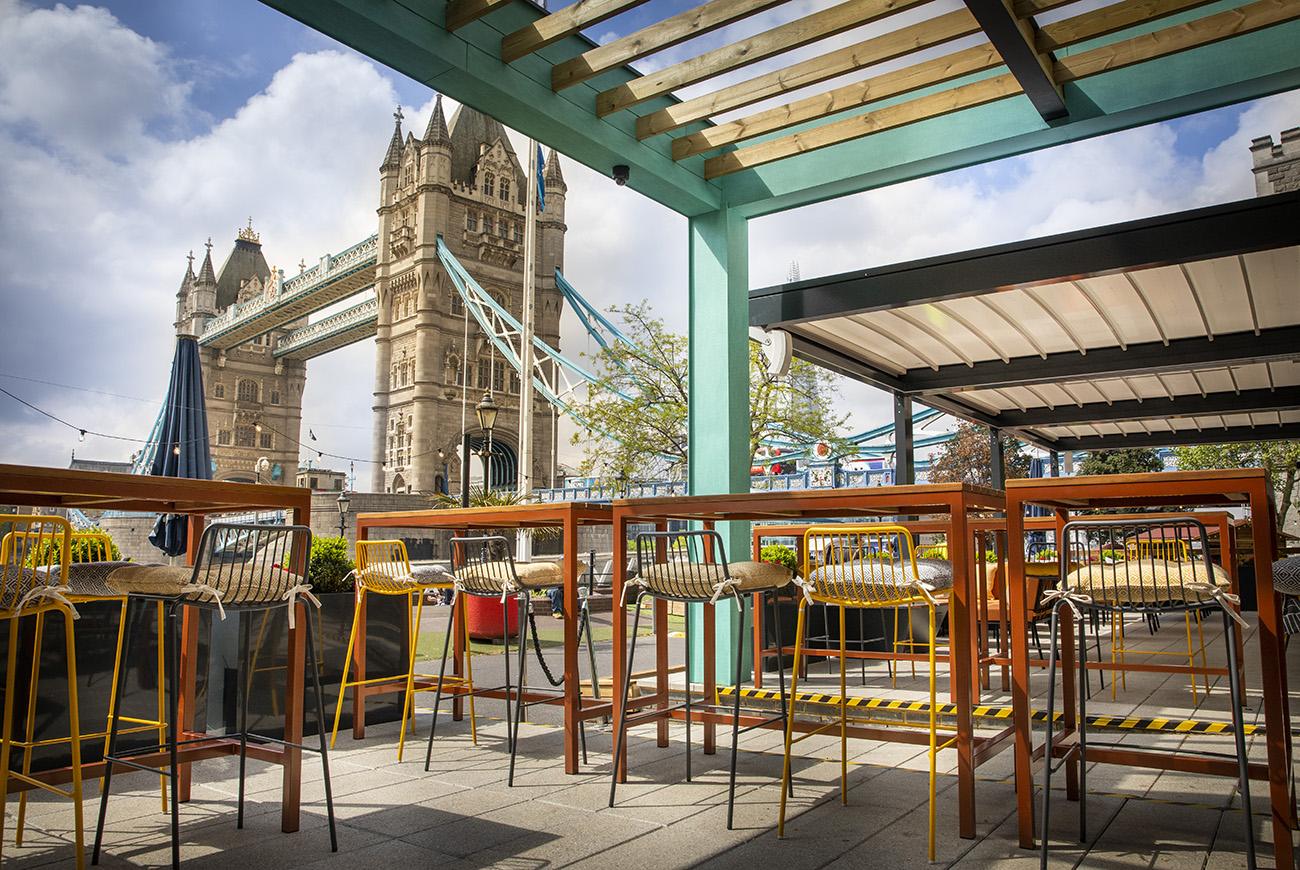 Outdoor dining area with a view of London Bridge